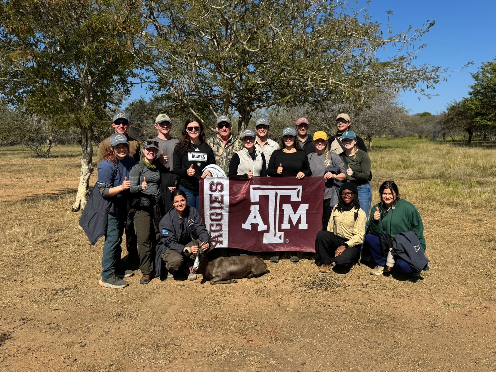 Texas A&M veterinary students and instructors together after a supervised antelope case